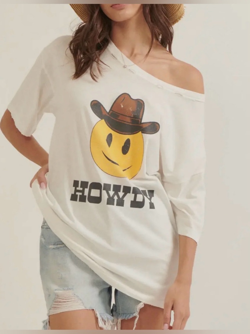 Promesa White Off-Shoulder Top with Yellow Smiley and Brown Cowboy Hat Graphic